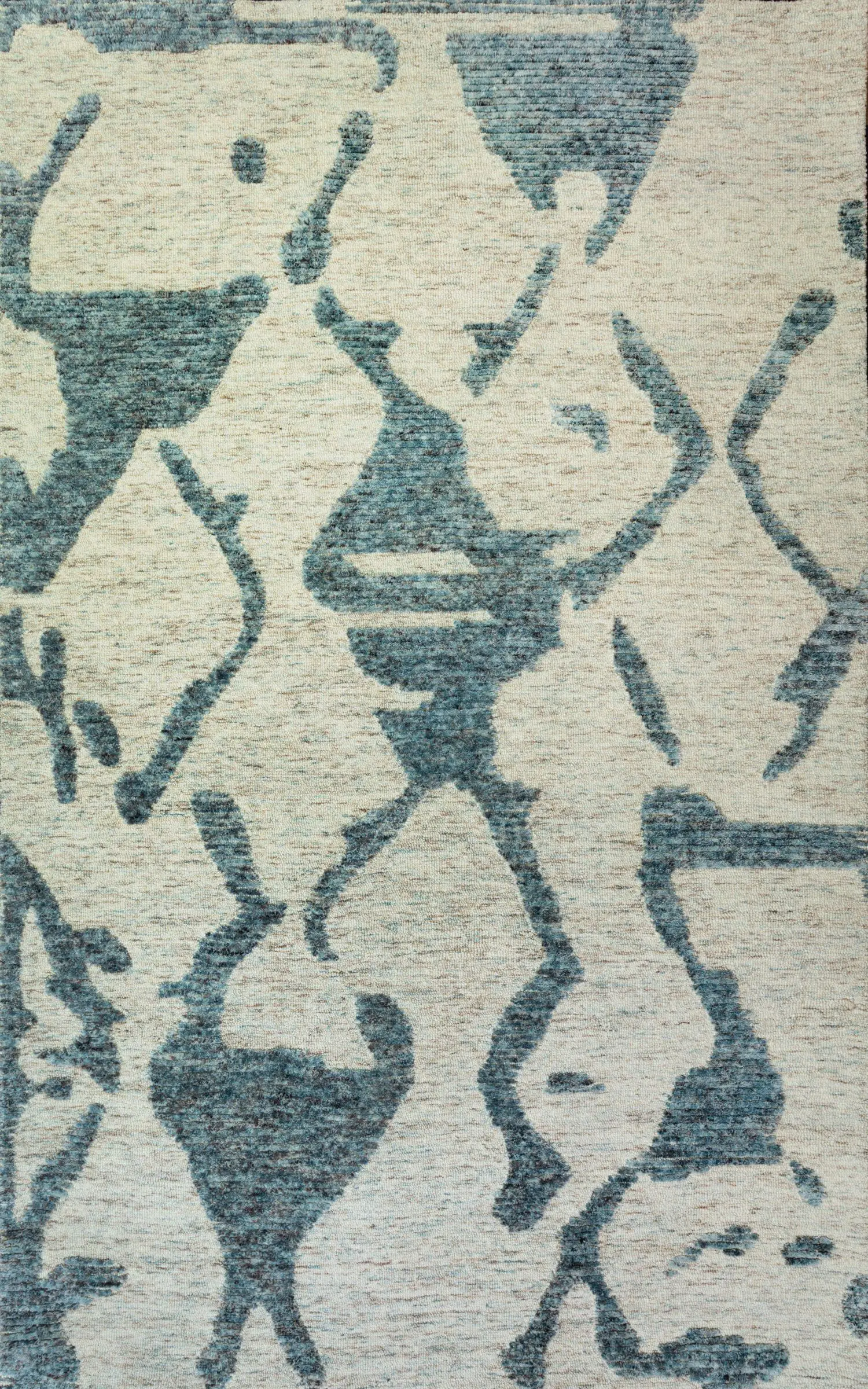 Abstract blue floral pattern on a light beige rug.