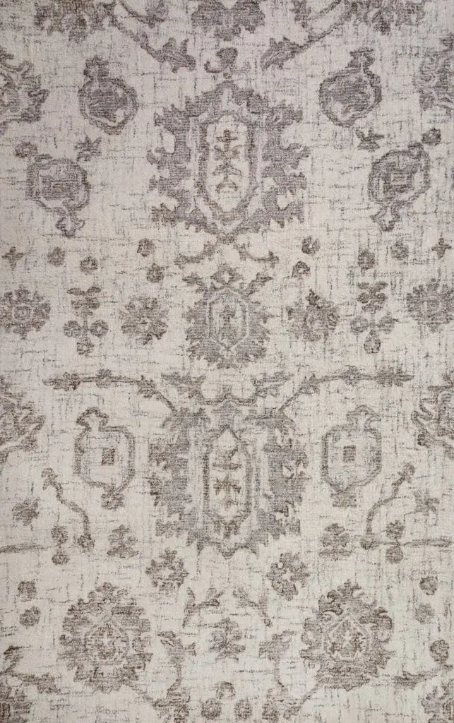 Beige vintage rug with faded brown floral medallion patterns on a cream background.
