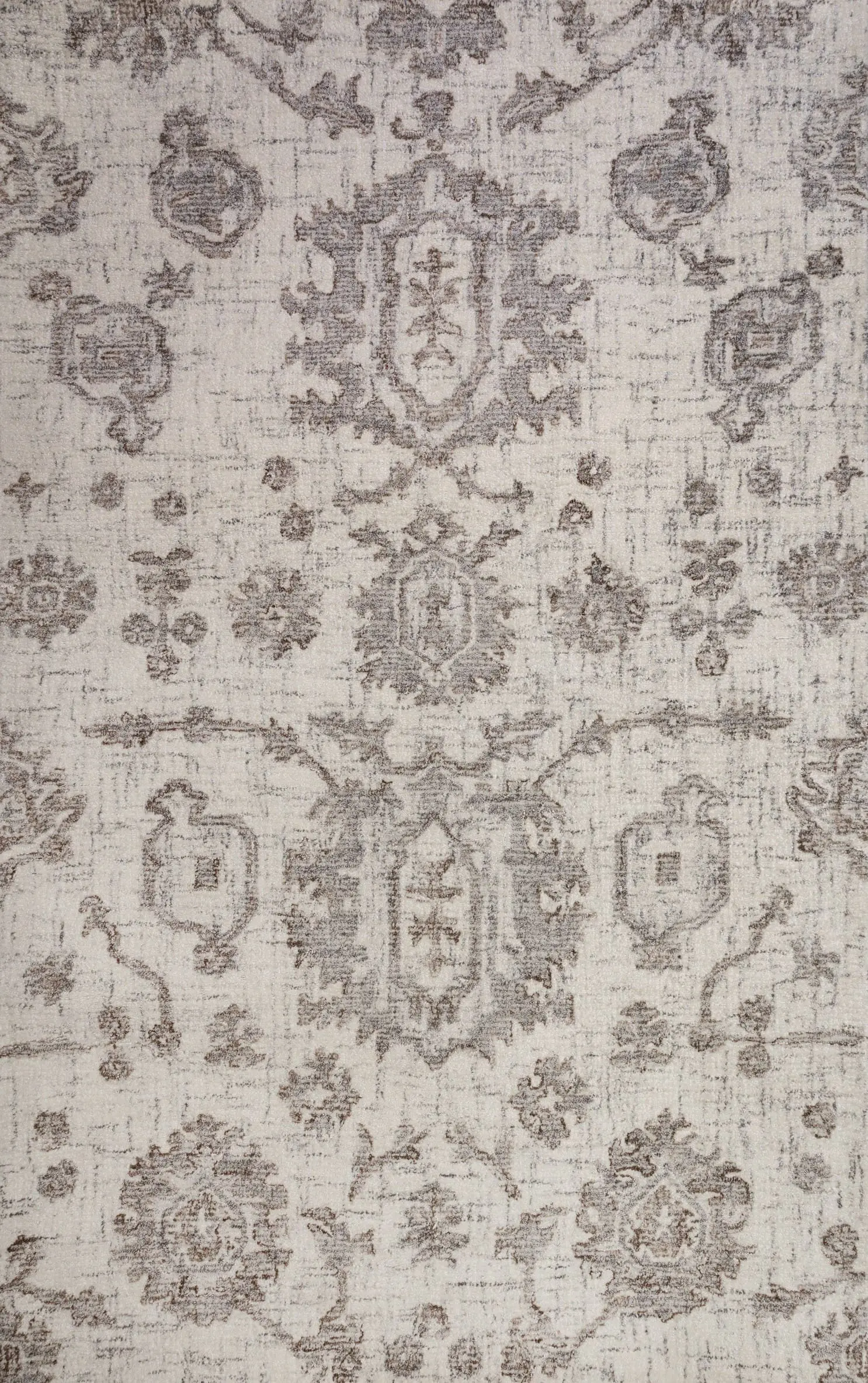 Beige vintage rug with faded brown floral medallion patterns on a cream background.