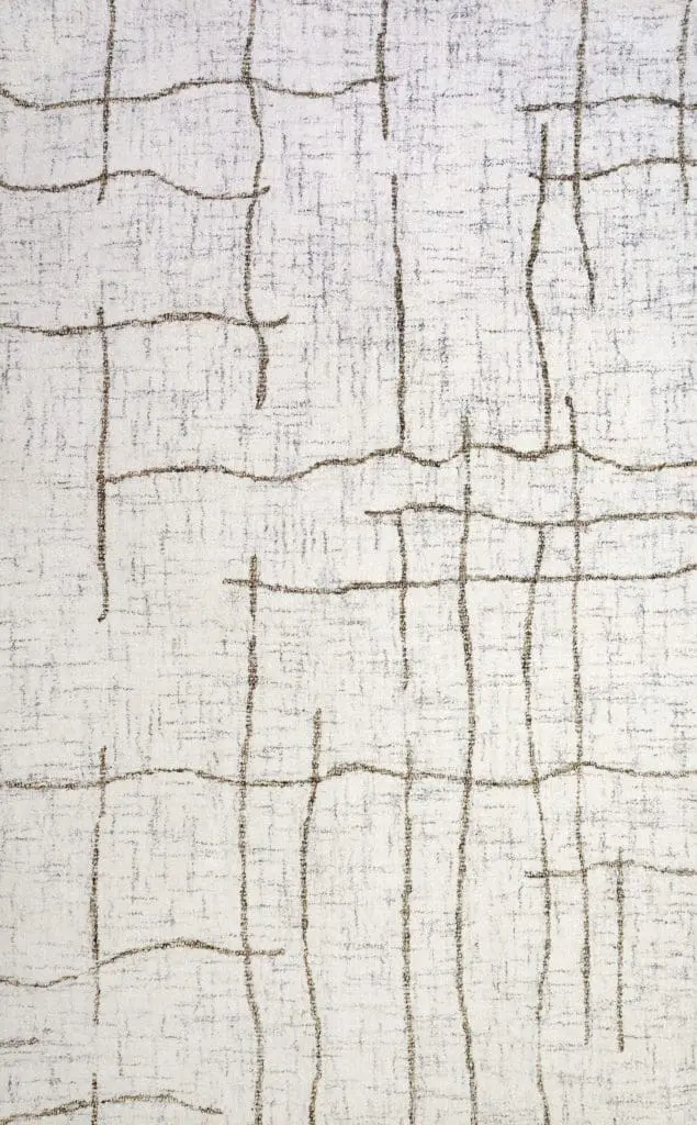 Beige rug with irregular brown vertical and horizontal lines forming a geometric pattern in cream. (Close-up textile)