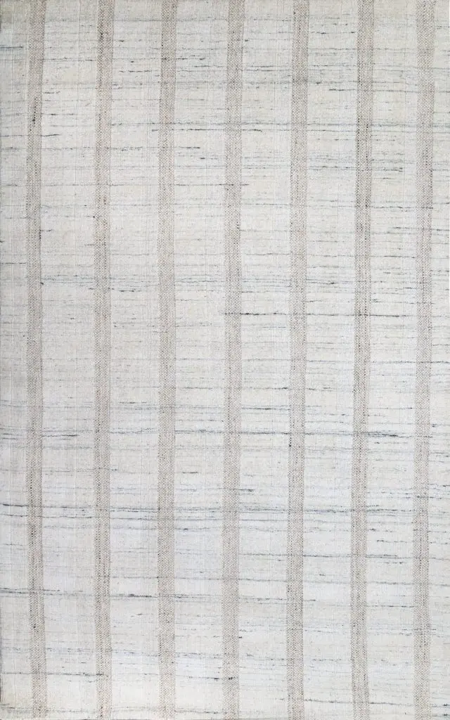 Light cream rug with subtle vertical beige stripes and scattered blue-gray accents, woven texture visible throughout